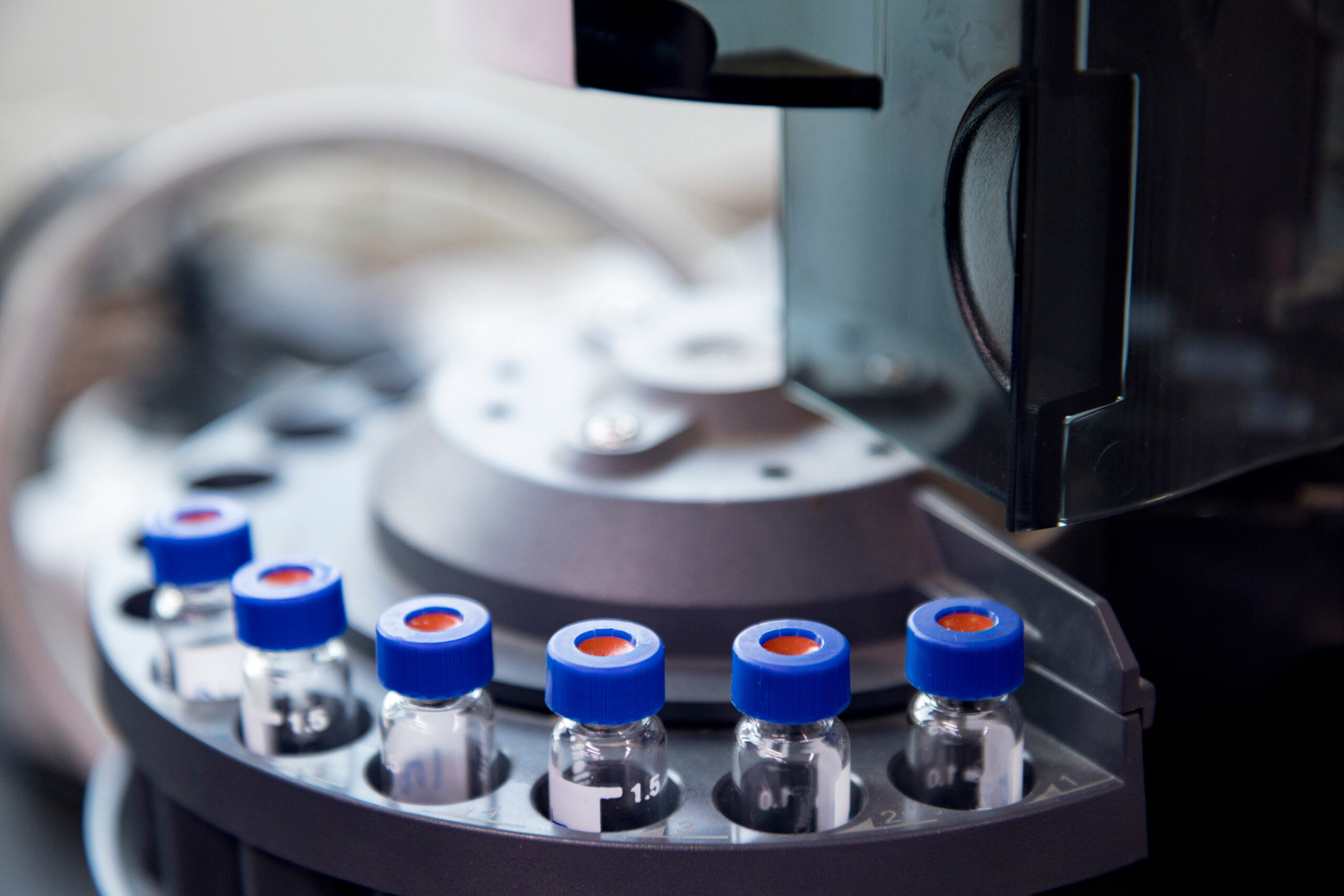 Laboratory centrifuge with vials for scientific research.